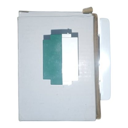 A white plastic multi-socket wall outlet module with a green base, featuring two UK-style three-pin sockets on top and a central keyhole-shaped opening.