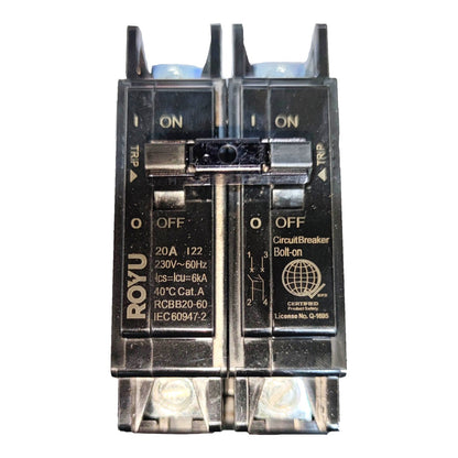 A two-pole circuit breaker with a black plastic housing, featuring gold-colored text and labels, shown against a plain white background.