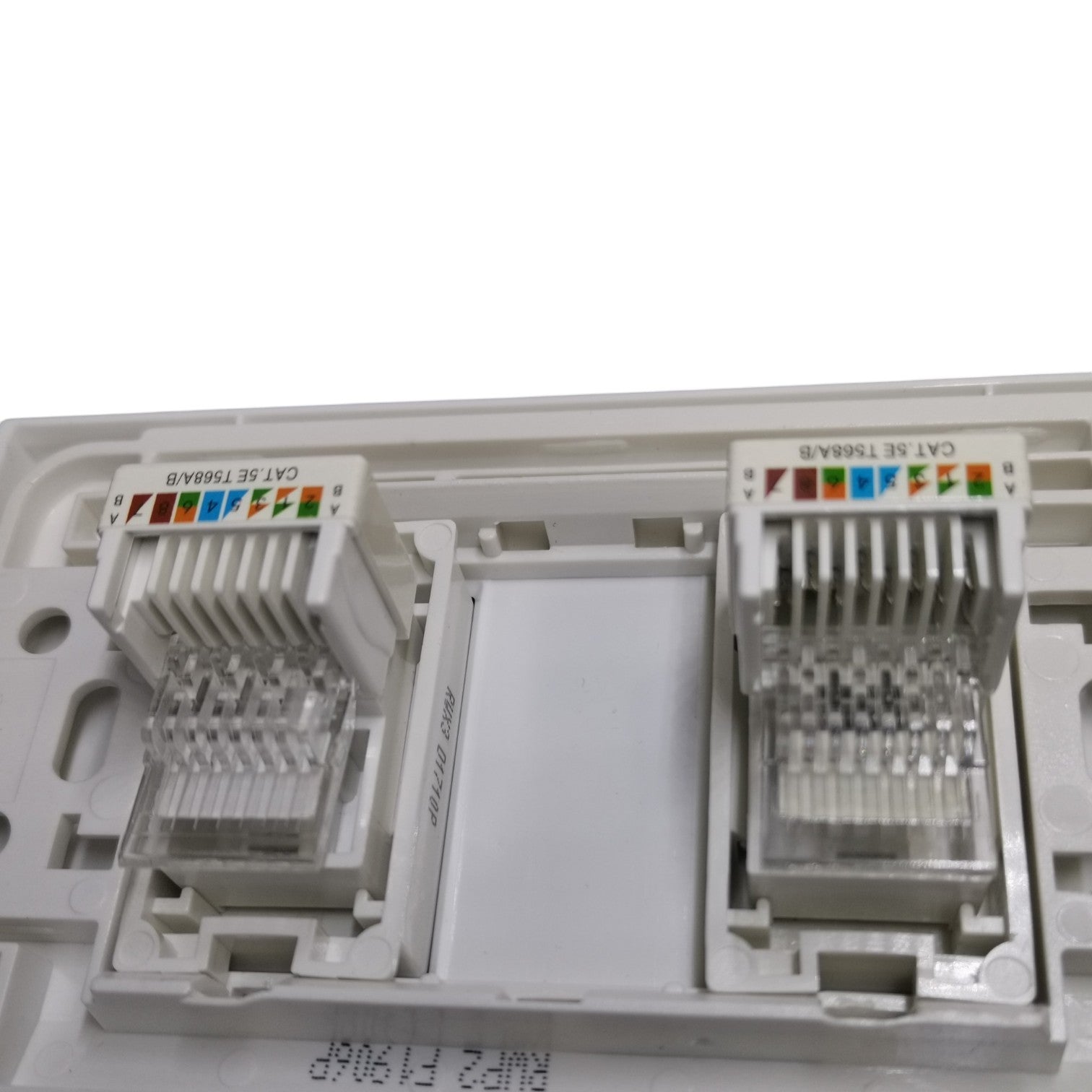 Two RJ45 CAT 6 ethernet network module connectors in a white plastic modular patch panel, shown against a white background.