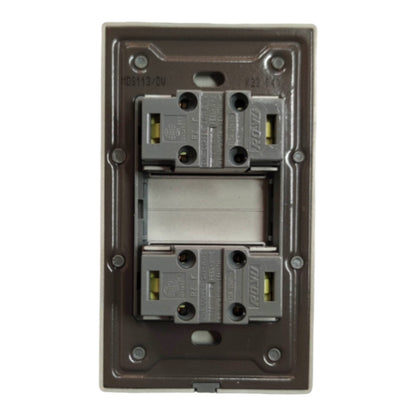 A two-way electrical switch module with two gray contact blocks and a central white spring contact, set within a dark brown metal backplate.