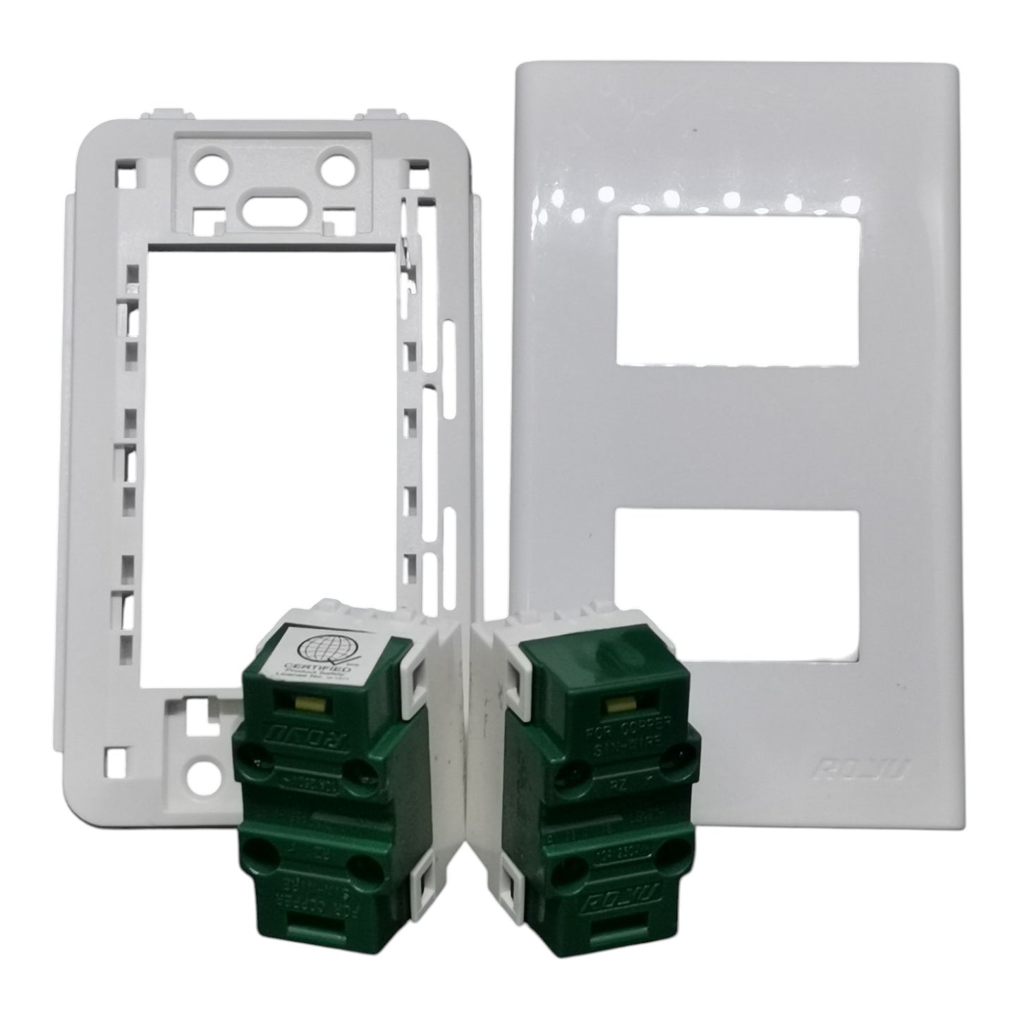 Two white electrical outlet plates shown with two green modular switch modules in front, photographed on a plain white background.
