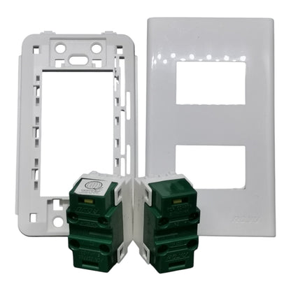 Two white electrical outlet plates shown with two green modular switch modules in front, photographed on a plain white background.