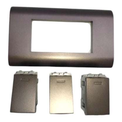 A dark metallic gray electrical panel faceplate with a rectangular cutout, shown above three matching rectangular mounting components on a plain white background.