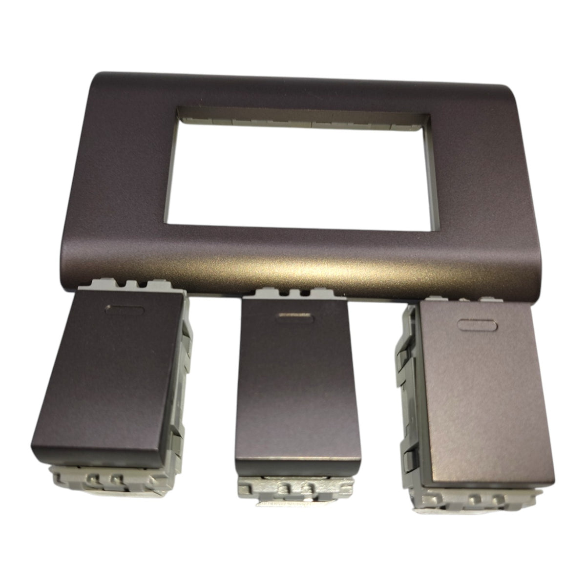 A set of dark metallic car interior trim pieces, including a rectangular bezel insert and three matching rectangular switch or control modules with exposed terminal bases, shown on a plain white background.