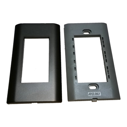 Two black plastic electrical outlet cover plates shown side by side on a white background, with the right plate featuring a visible 'RO.YU' brand logo.
