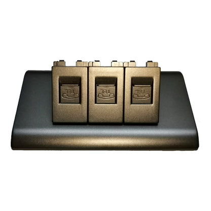 A three-pickup electric guitar bridge assembly in a metallic bronze finish, mounted on a black base plate, shown against a plain white background.