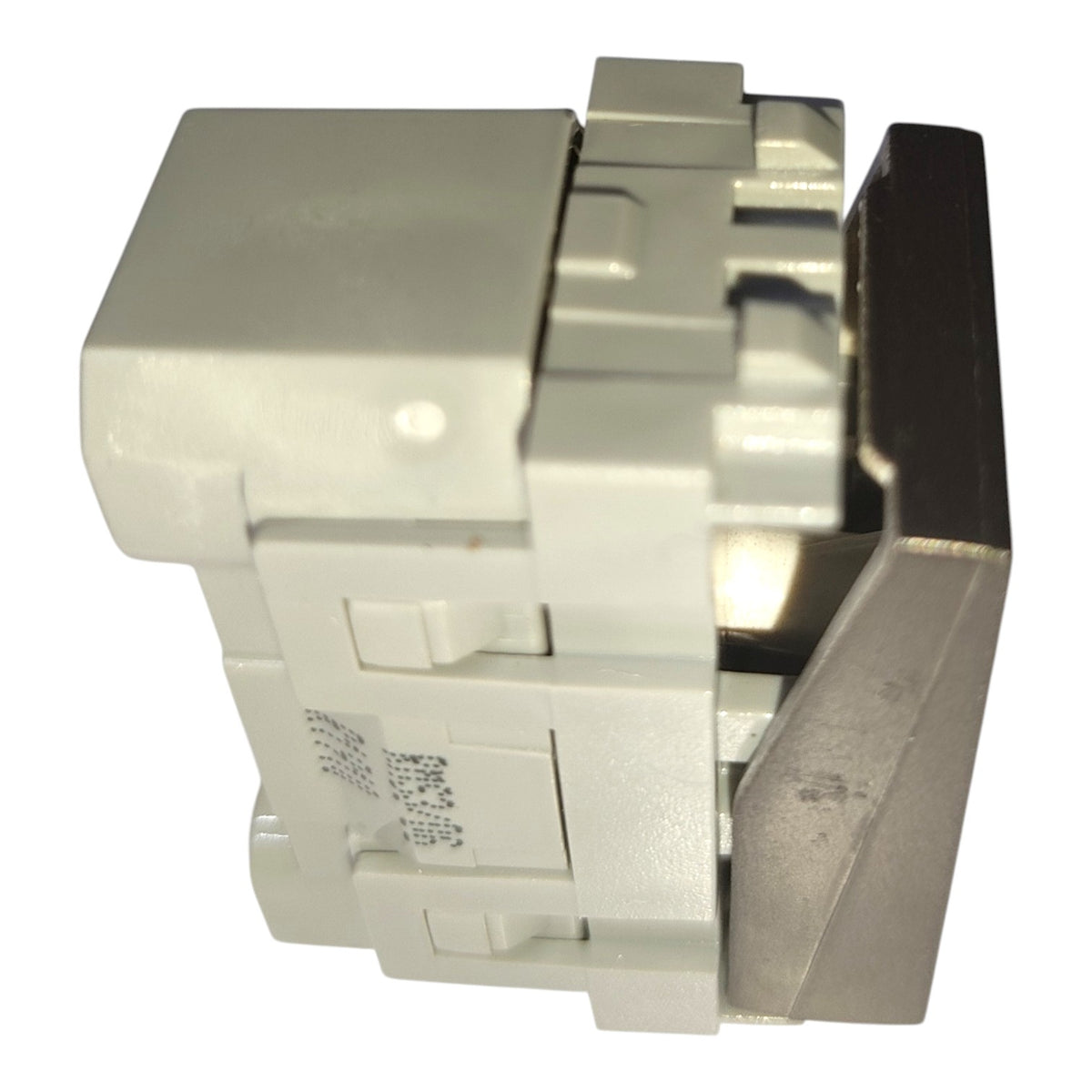 A close-up of a light gray plastic electrical connector or switch component with a dark metal lever, shown on a plain white background.