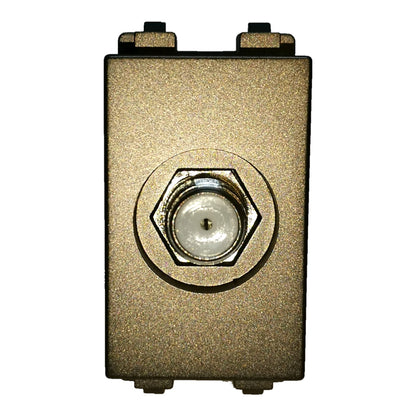 A square metal electronic module or enclosure with a textured gold finish, featuring a central hexagonal threaded port with a clear lens and two black terminal pieces at the top and bottom, shown against a plain white background.