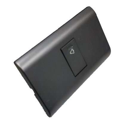 A black plastic automotive switch panel cover with a recessed toggle switch featuring a white triangle symbol, shown on a plain white background.