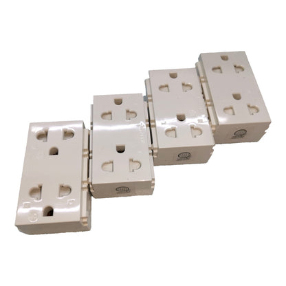 Four cream-colored plastic multi-socket wall outlets arranged diagonally on a plain white background.