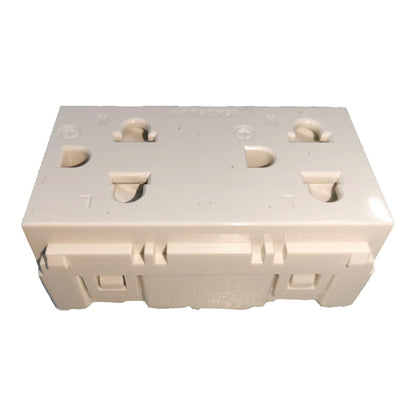 An off-white plastic electrical outlet cover plate or socket cover, photographed from a top-down angle on a white background.