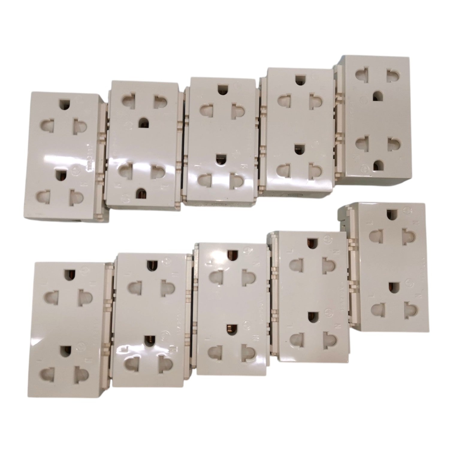 Six beige wall outlet blocks arranged in two rows on a plain white background.