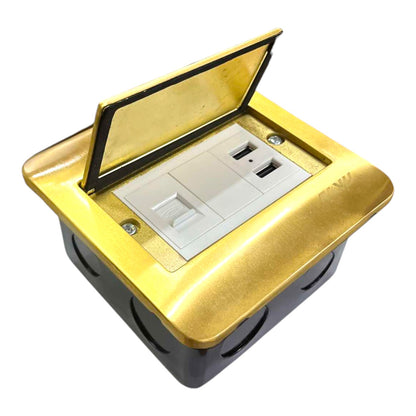 A gold and black electrical outlet cover with a hinged lid open, revealing a white double outlet socket inside, shown on a plain white background.