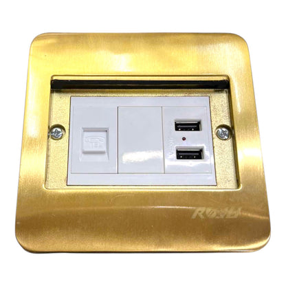 A gold-plated metal wall outlet cover plate featuring a white double socket with two USB-A ports and a power switch, shown on a plain white background.