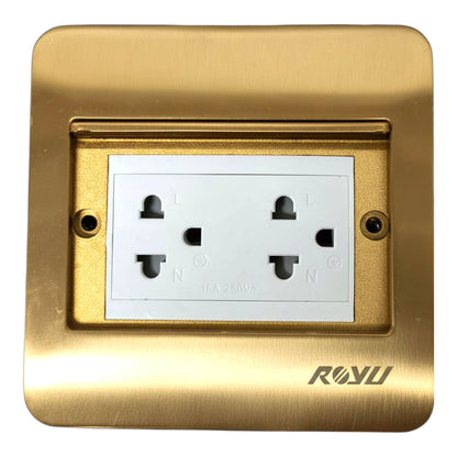 A brushed gold metal double outlet wall socket cover plate with a white internal socket insert and the brand name ROYU printed in gold at the bottom right.