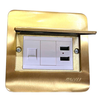 A brushed gold metal wall outlet cover plate with a hinged lid propped open, revealing a white double switch and two USB-A ports. The brand name 'RONU' is debossed on the bottom right corner of the plate.