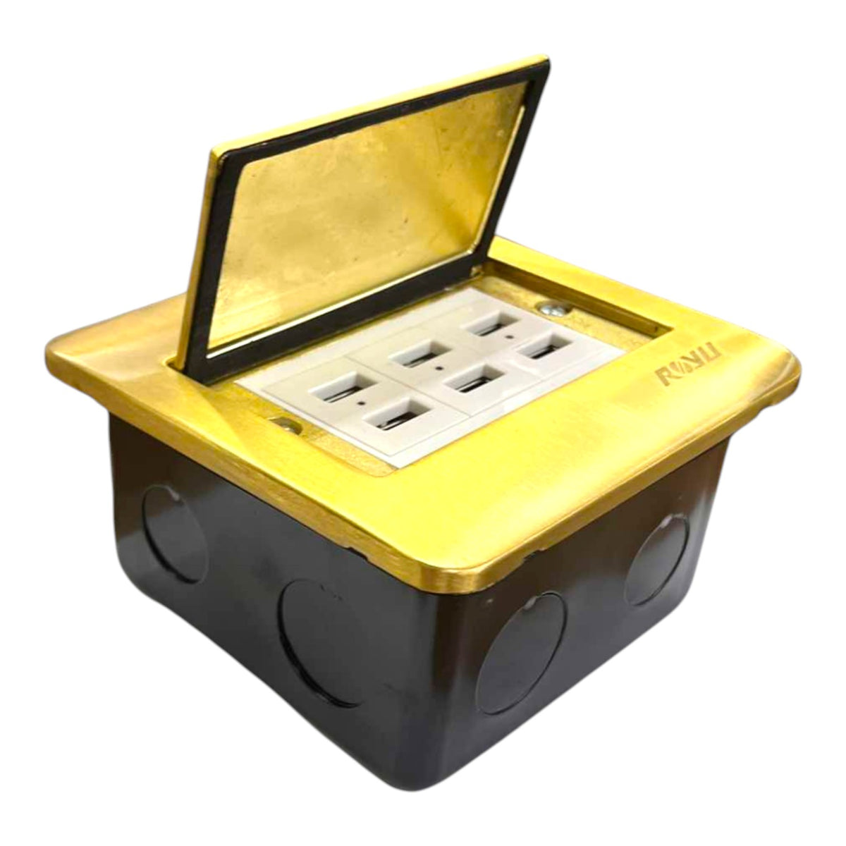 A square electrical outlet box with a black plastic base and a metallic gold top lid that is open, showing multiple USB-A and USB-C ports on a white insert. The brand name 'RUSH' is printed on the gold lid.