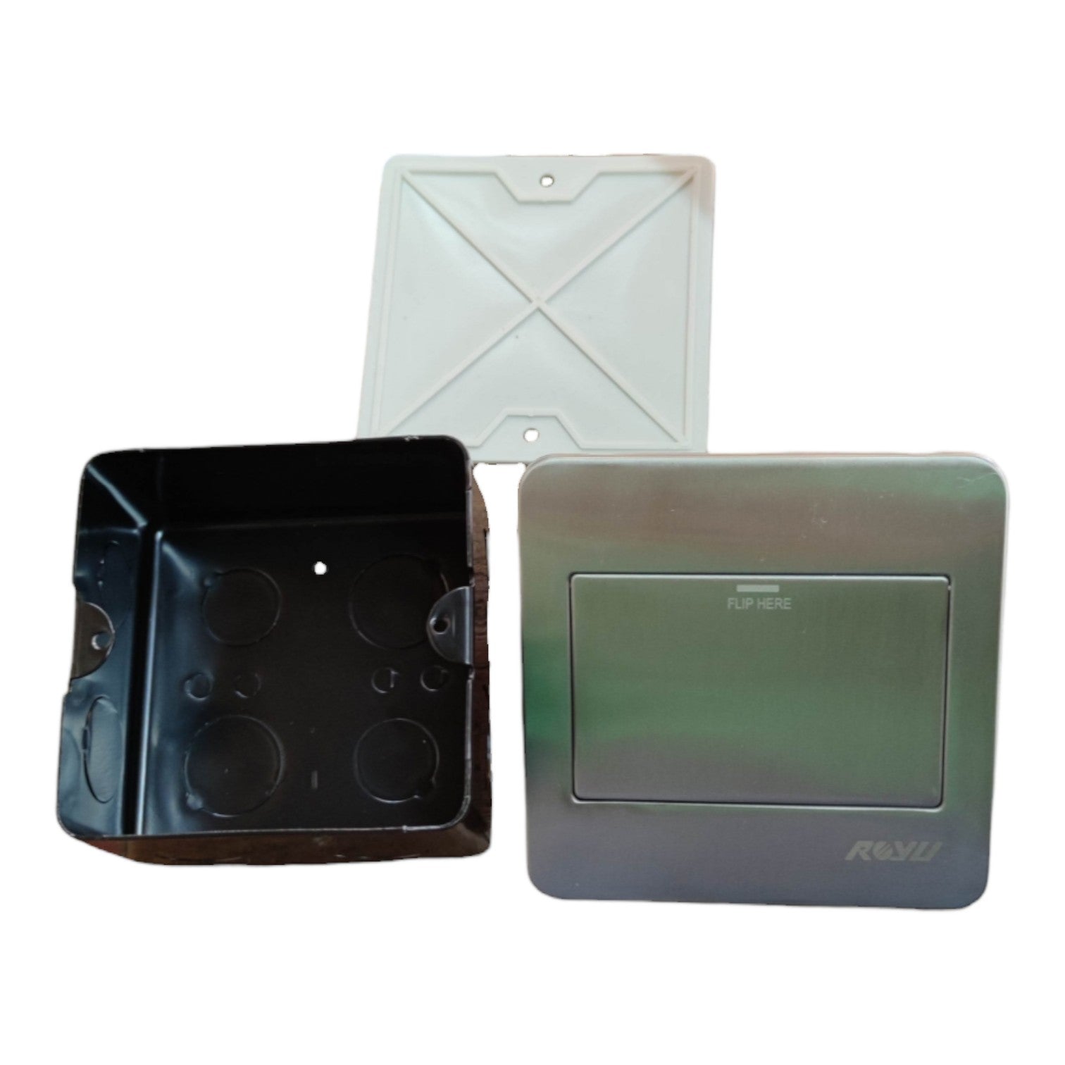 A metal electrical junction box kit showing the black interior tray, a white mounting cover, and a silver-gray faceplate with a recessed label area and a visible 'ROVI' brand logo.