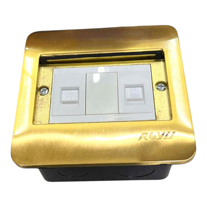 A modern three-gang light switch plate with a brushed gold metal outer frame and a white plastic inner faceplate, mounted on a black base. The brand name 'RONU' is embossed on the bottom right of the gold frame.