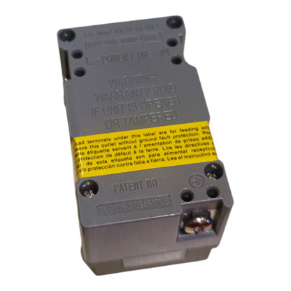 A gray plastic electrical power line module with a yellow warning label, photographed on a white background.