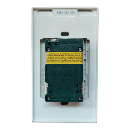 A marine electrical marine contactor with a dark green coil and a yellow warning label, housed in a white plastic faceplate.