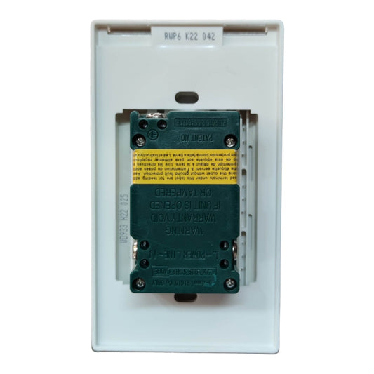 A marine electrical marine contactor with a dark green coil and a yellow warning label, housed in a white plastic faceplate.
