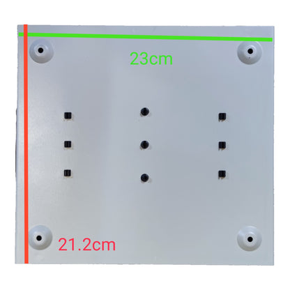 A square white panel or board shown from the back, with four circular mounting holes at the corners, six small black screw holes in the center, and green and red dimension lines with measurements 23cm and 21.2cm overlaid.