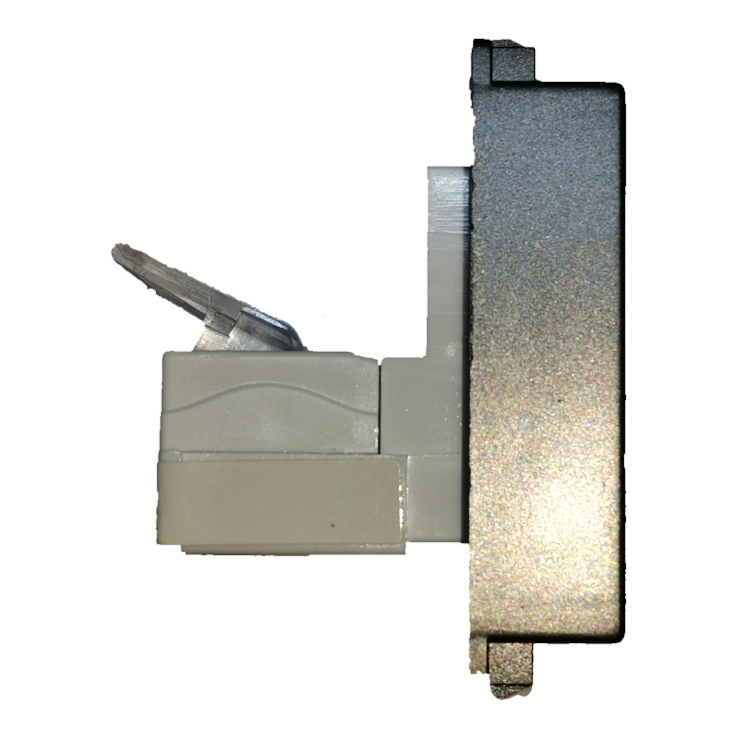 A close-up of a metallic and plastic mechanical component, likely a lock cylinder or switch part, featuring a textured silver metal body and a beige plastic housing with a small key visible.