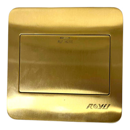 A square brushed brass wall switch plate with a recessed central button area and the brand name 'RANU' printed at the bottom right.
