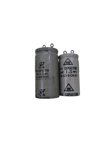 Two electrical capacitors labeled 1.5 MFD and 350V running capacitor 1MFD for circuit applications