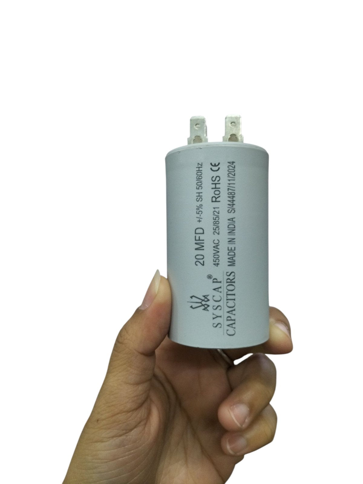 20uF 450V motor running capacitor by Syscap in a hand for easy viewing and installation