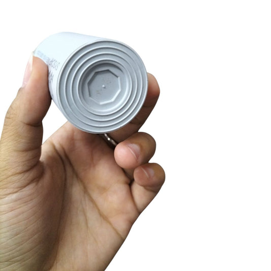Syscap motor capacitor showing circular design and electrical part details