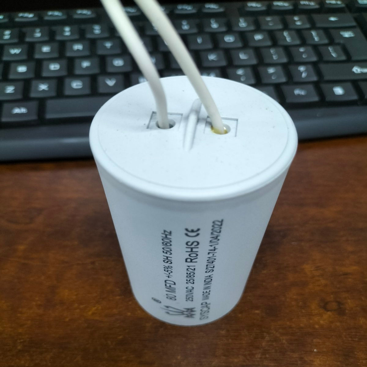 SYSCAP Motor Running capacitor 80Mfd 250V AC white cylindrical electrical component with wires