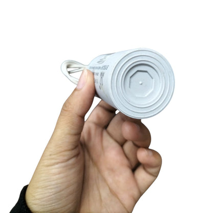 Syscap Motor Capacitor held in hand featuring a durable design for reliable electrical performance