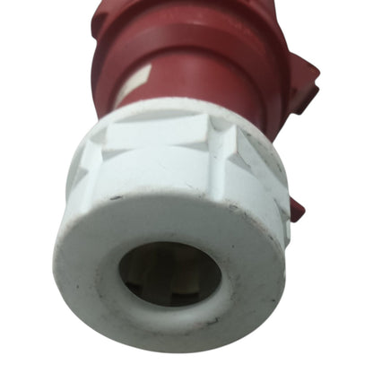 Close-up of a red and white valve or connector on a white background