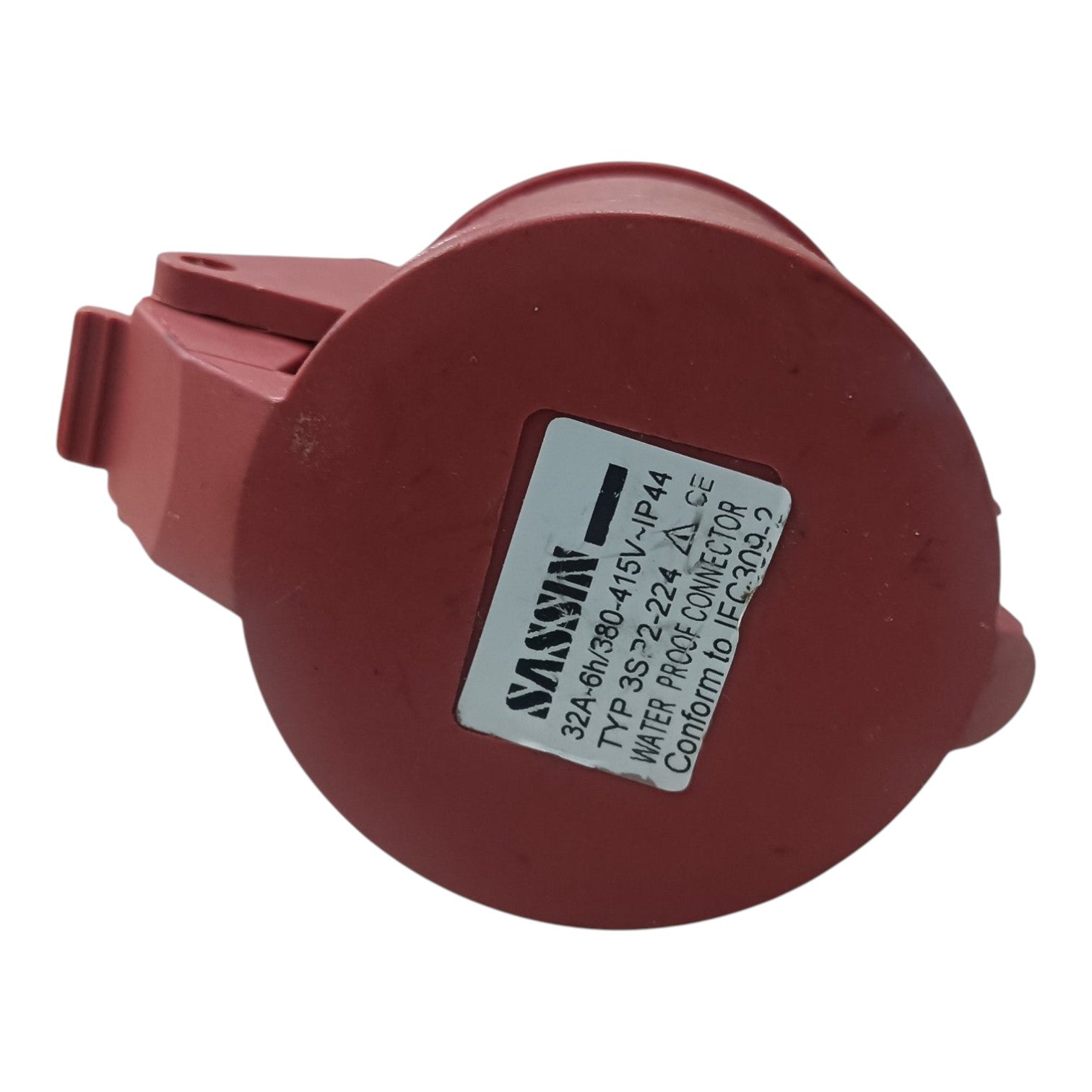 Red electrical connector with a label on a white background