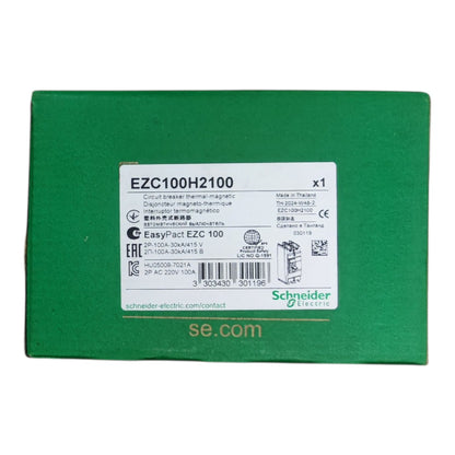 A green Schneider Electric EZC100H2100 product box with a white label showing model details and the Schneider Electric logo.