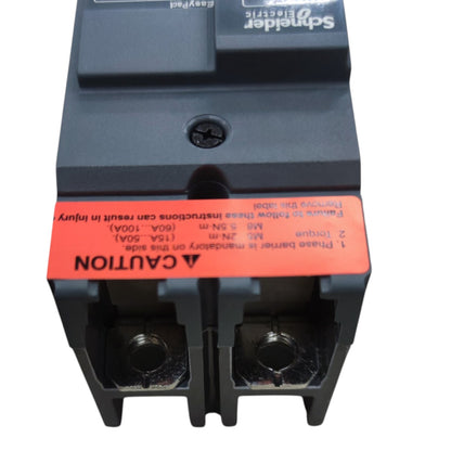 Schneider Electric IEC 320A molded circuit breaker with a prominent orange safety label on a white background.