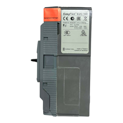 A Siemens EasyPact EZC 100 circuit breaker module, featuring a gray plastic housing with a white technical label and an orange protective cap on top.