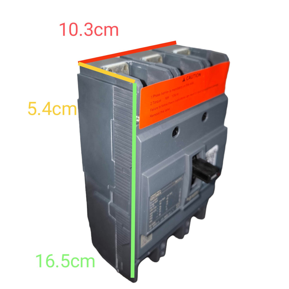 A gray electrical circuit breaker with an orange warning label, shown on a white background with dimension annotations in red, yellow, and green indicating 10.3 cm, 5.