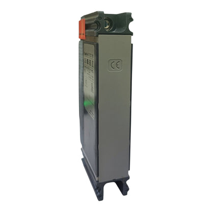 A gray electrical component or module with a dark green top section, an orange terminal cover, a CE mark, and a small green button, shown on a plain light gray background.