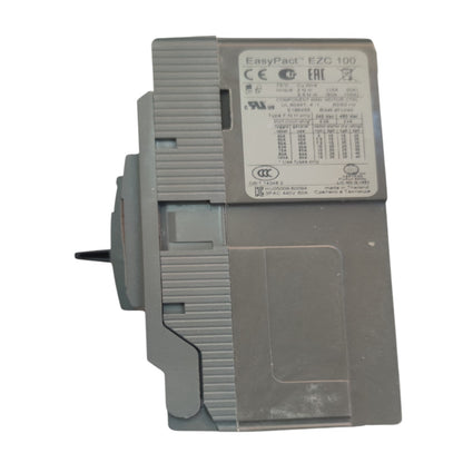 A gray EasyPact E2C 100 relay module with technical specifications printed on its top surface, shown against a plain white background.