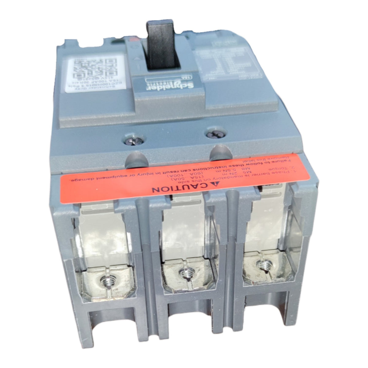 A Schneider Electric circuit breaker with a gray plastic housing, three terminal compartments, and a prominent orange caution label on the front.