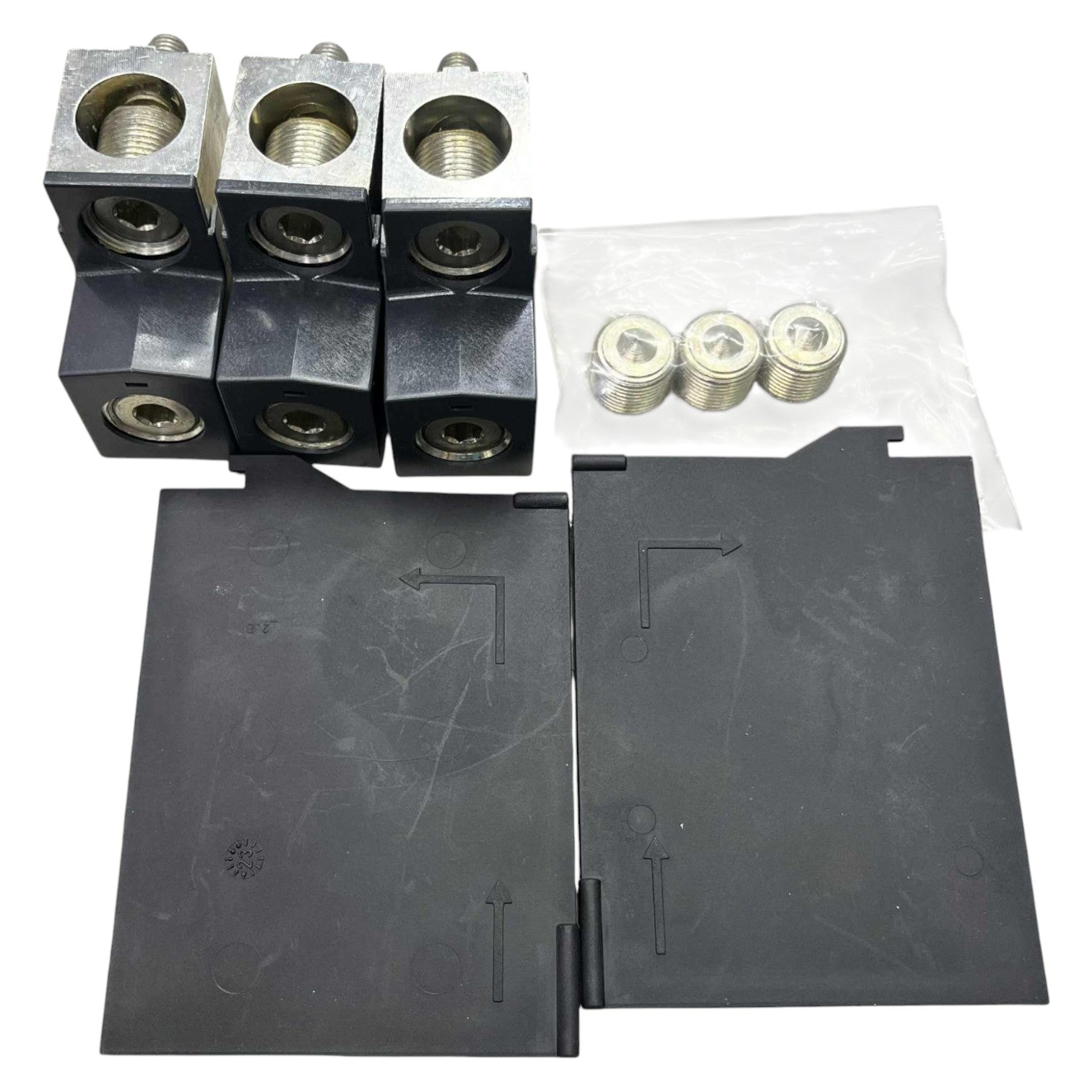 Set of metal components and black plastic parts on a white background
