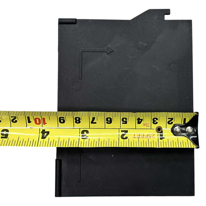 Black label tape with a measuring tape showing its width on a white background