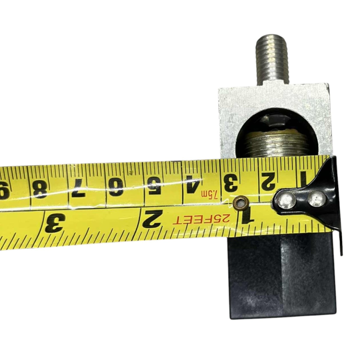 Mechanical component with a tape measure for scale on a white background