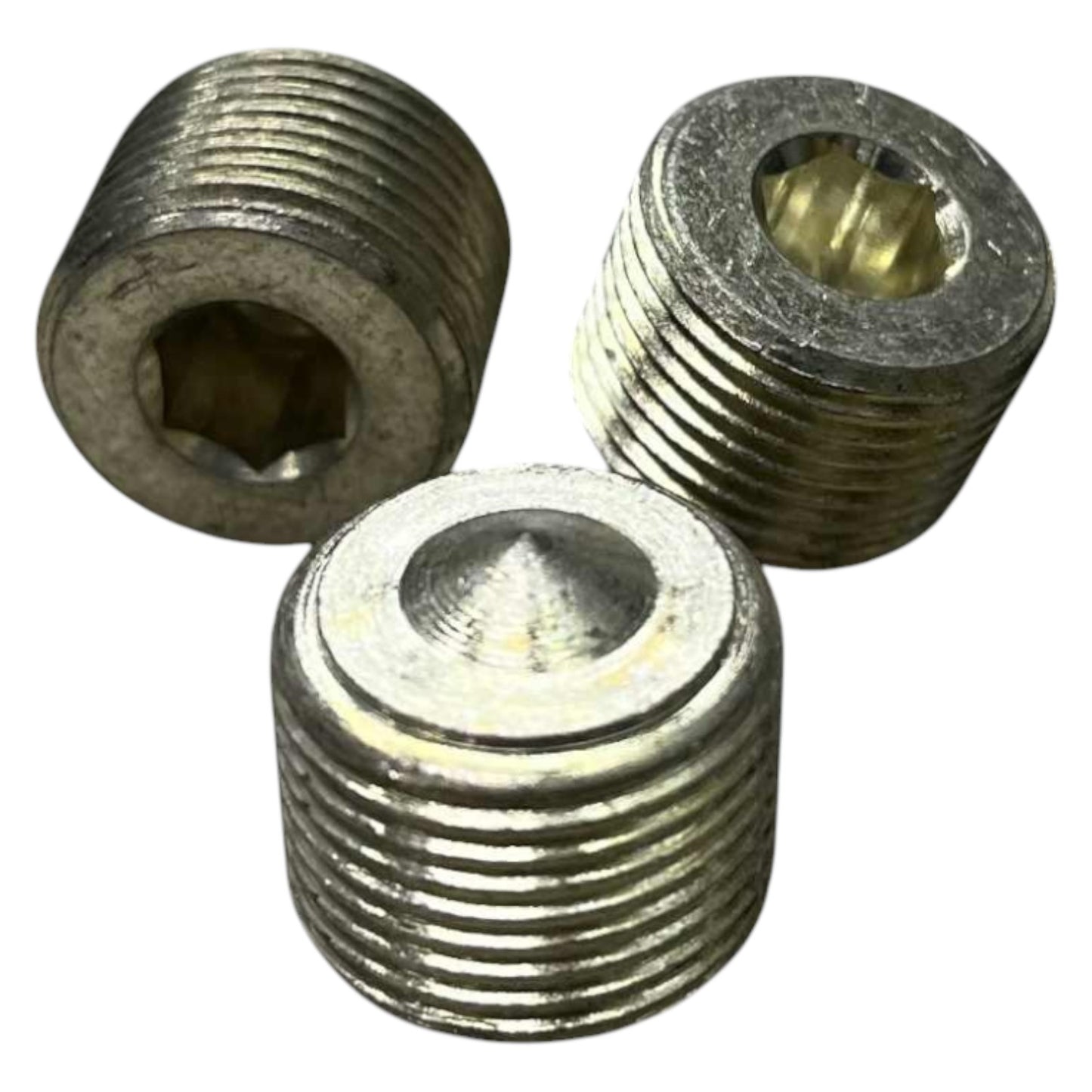 Three metal threaded inserts on a white background