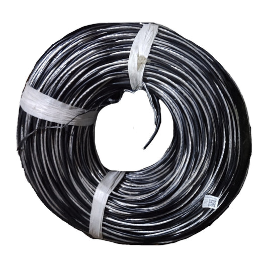 Coiled black cable with a white tag on a white background