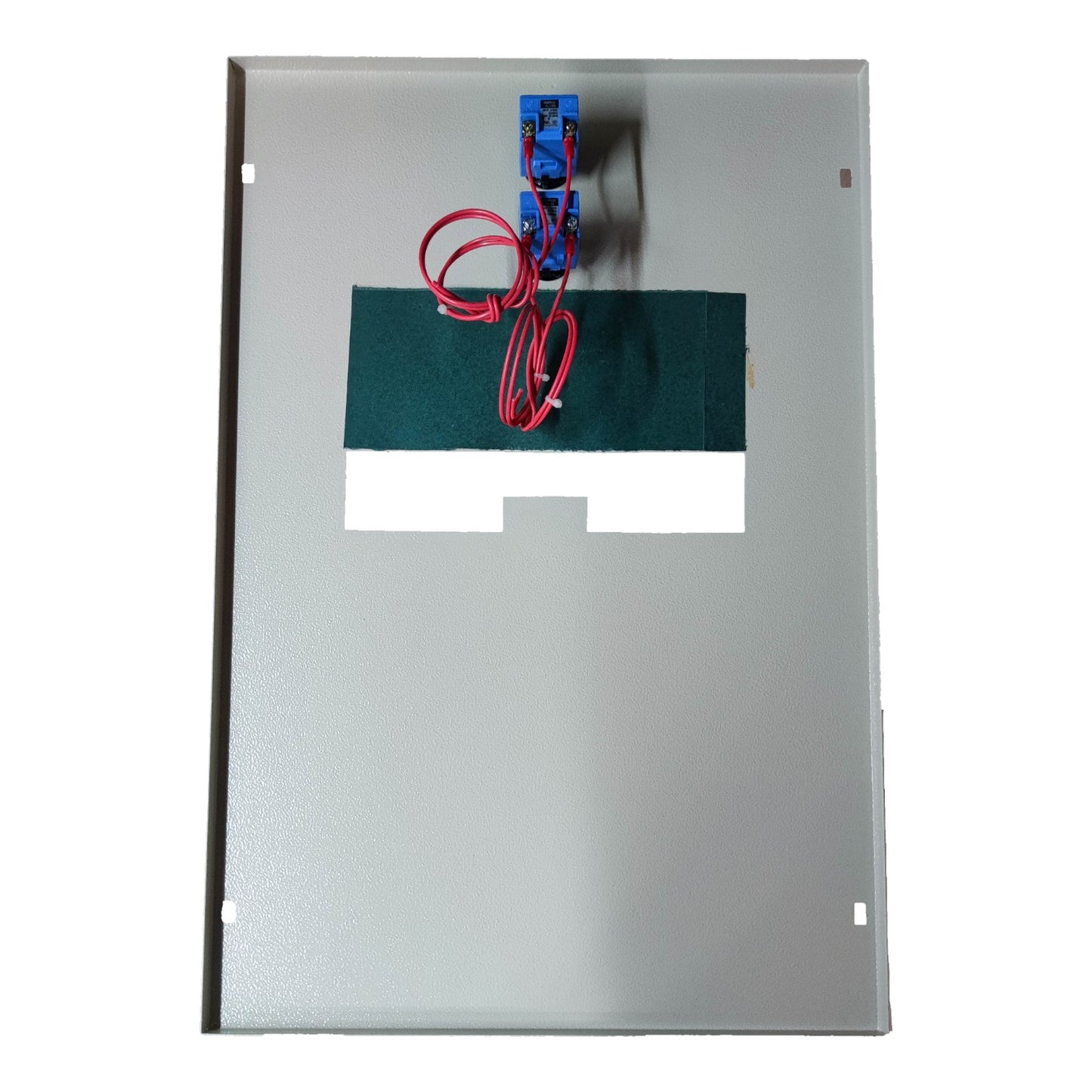 Metallic panel with green component, red wires, and blue connector on a white background