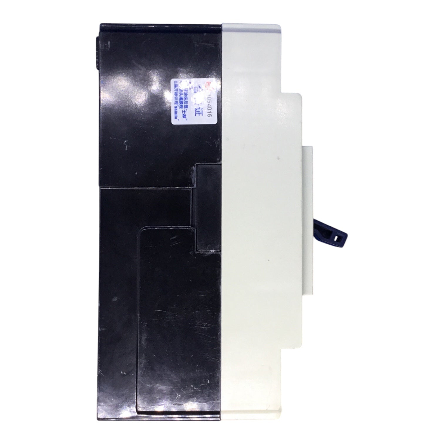 A black and white plastic electrical component or switch module with a small blue and white sticker on the side, shown against a plain white background.